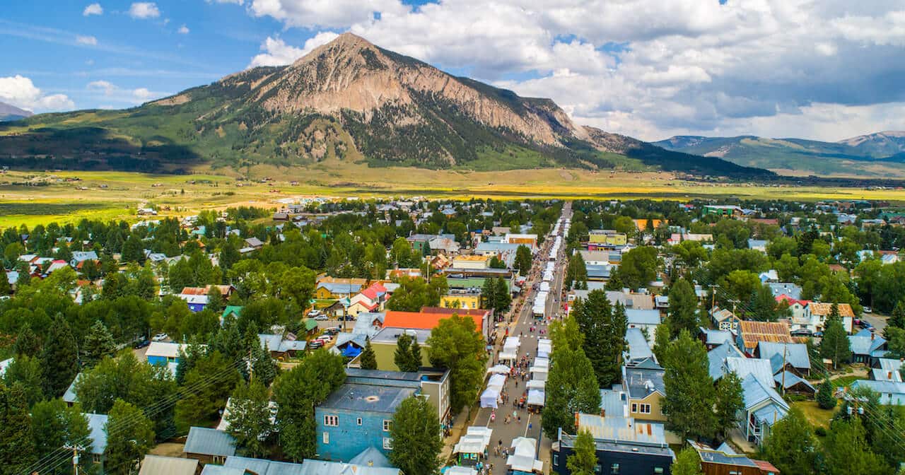 Crested Butte real estate - Property management services. Aerial image of Elk Avenue in the summer time.